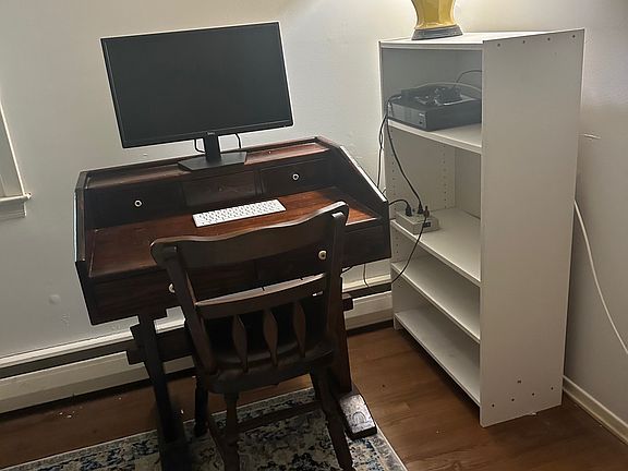 Desk and bookcase in bedroom