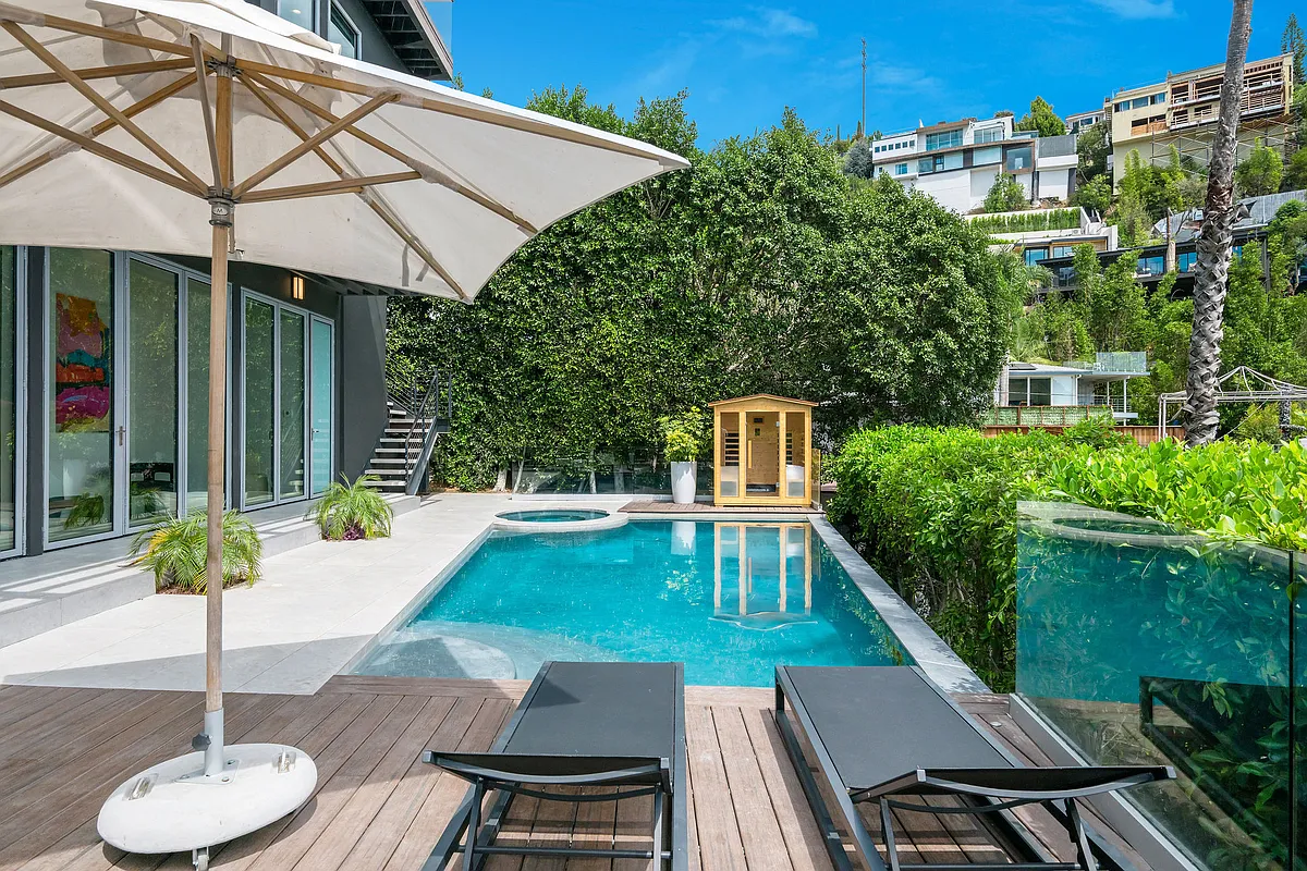 Outdoor area with pool, outdoor seating, indoor-outdoor fun room connecting the pool to the inside of the home - 1660 Sunset Plaza Dr