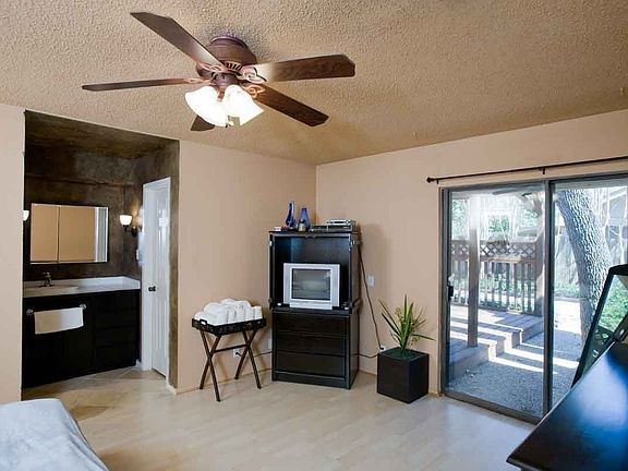 Large bedroom with door to backyard.