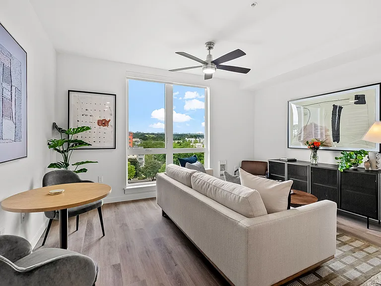 Light-filled luxury awaits: Enjoy spacious living areas with sleek flooring and floor-to-ceiling windows, flooding every corner with natural sunlight. ___