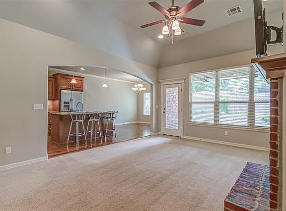 View of living room, kitchen and dining area from the front door!