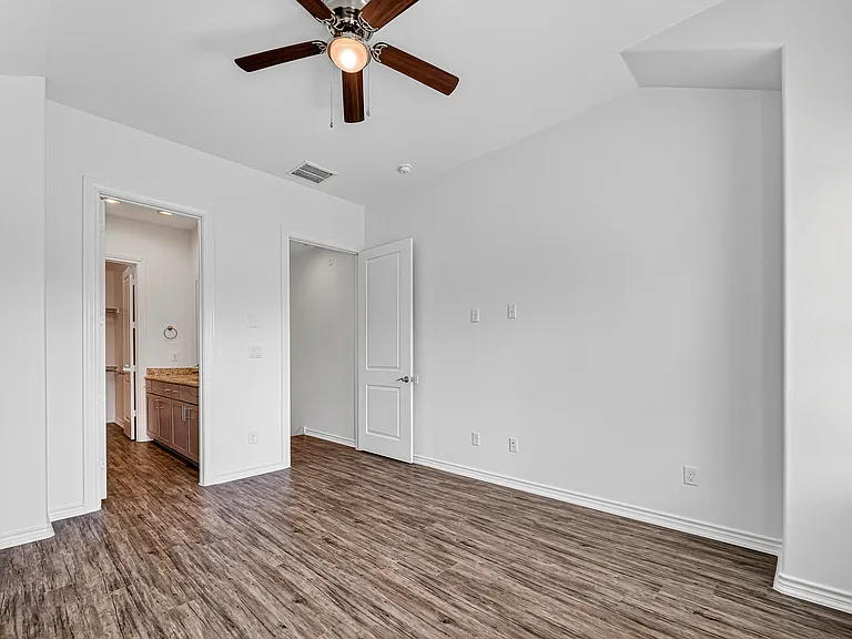 Spacious third-floor primary suite with high ceilings.
