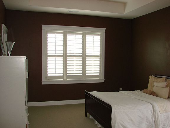 Suite features tray ceiling,plantation shutters,spacious bath and walk-in clos