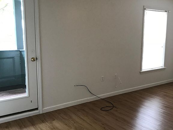 Master bedroom with walk-out to private patio and entrance to the bathroom.