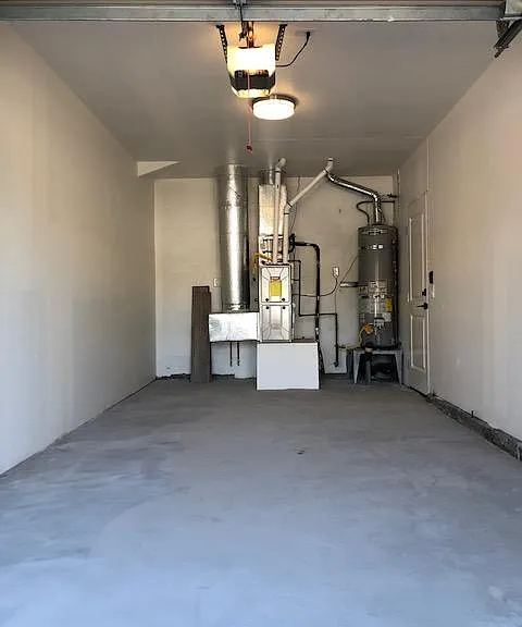 A/C, heater, water tank in the garage.