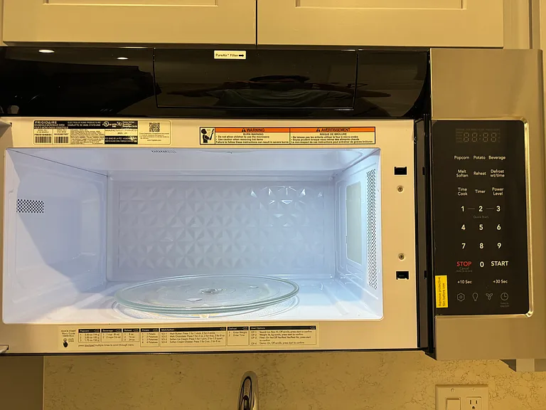 Closer view of vented microwave.