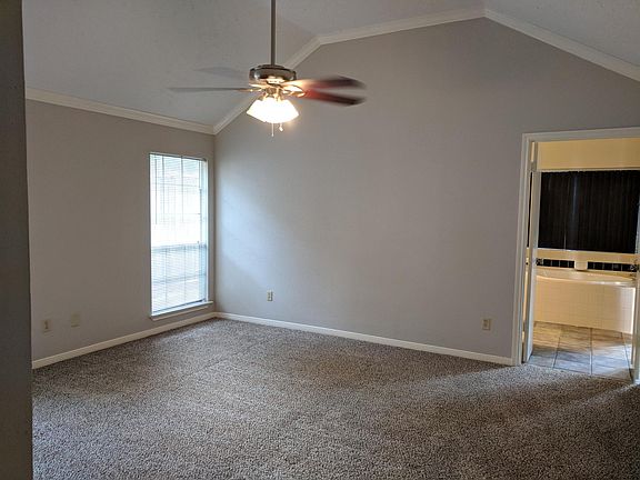 Master bedroom w/vaulted ceiling.