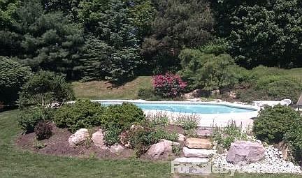 POOL
						:
						Beautiful gunite in-ground pool with hot tub. Heated and lighted.