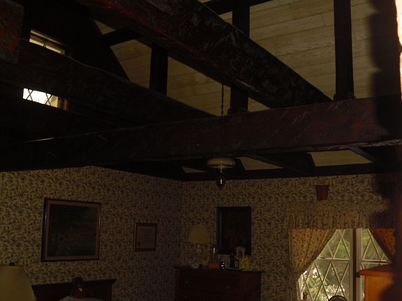 exposed beams in  master bedroom