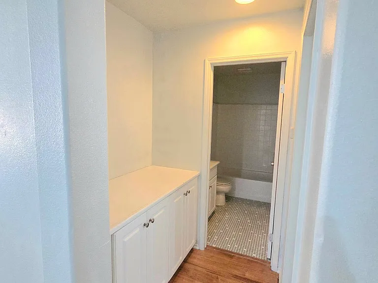 Convenient built-in storage located between the downstairs bedroom and full bathroom.
