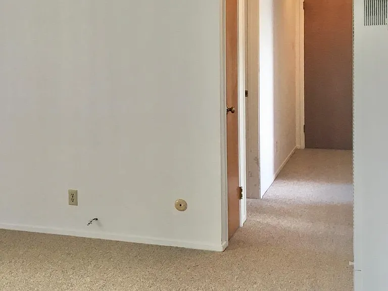 Hallway to bedrooms and bathroom.