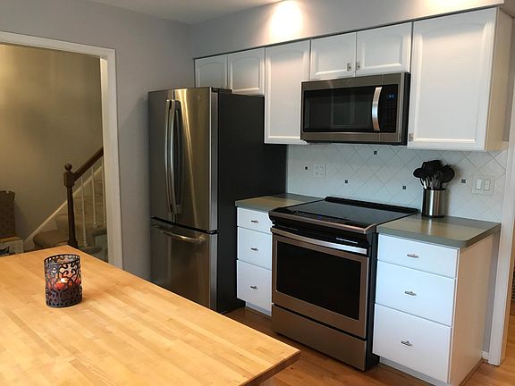 Kitchen with new stainless steel appliances