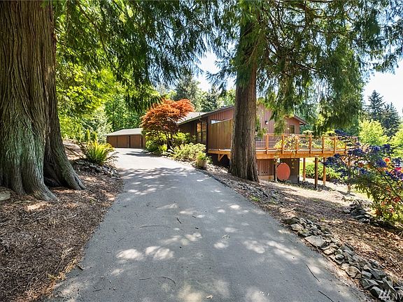 Long private drive circles around to the front of the house.