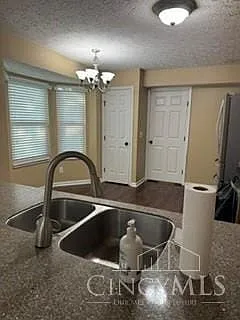 Main floor kitchen has hardwood floors, granite, pantry walk out to deck