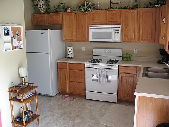 Open kitchen with pantry and upgraded cabinets