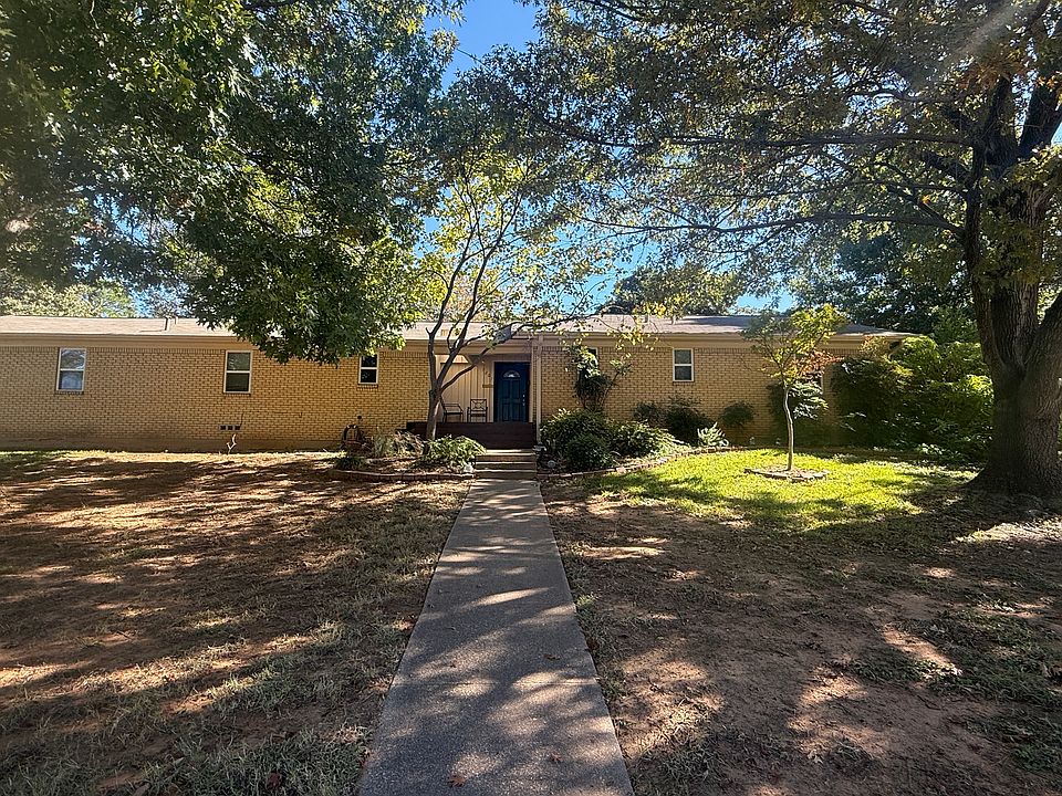 Front view featuring abundant, drought-tolerant native plants and a simple, easy-care garden.