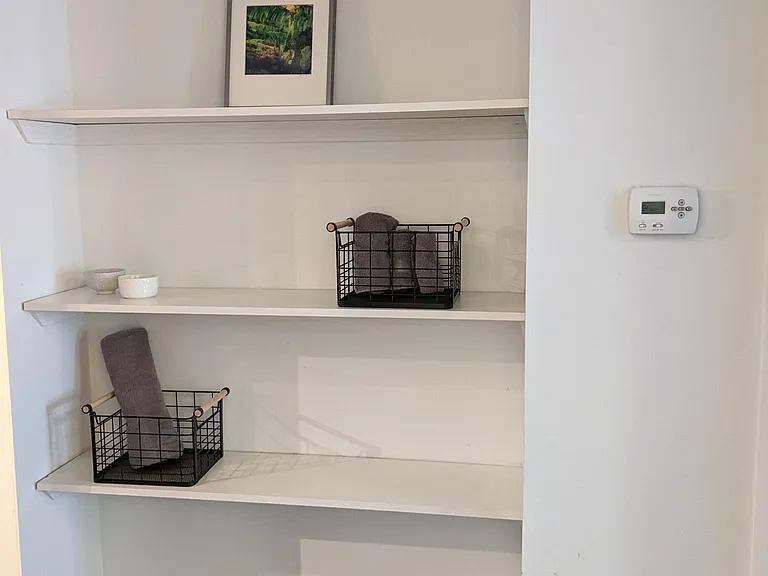 Hallway with storage shelves