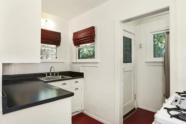 Kitchen view w/door to upper patio