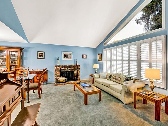 Vaulted ceiling in the living room. Entire interior has been repainted a neutral taupe. Not currently blue
