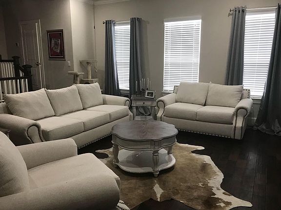 Living room, huge area with lots of space and gorgeous windows. A step up is the half bath on the stairs.