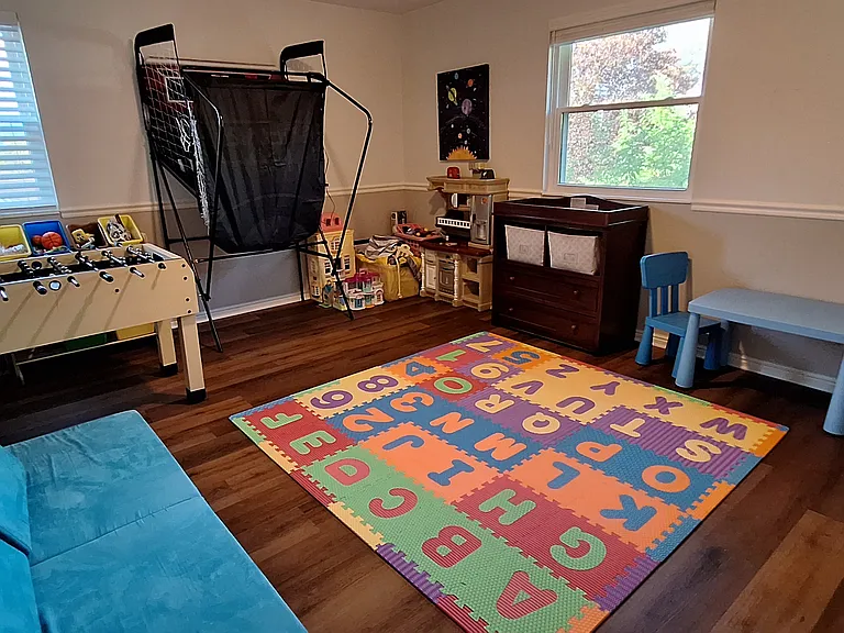 Upstairs bed (currently used as playroom)