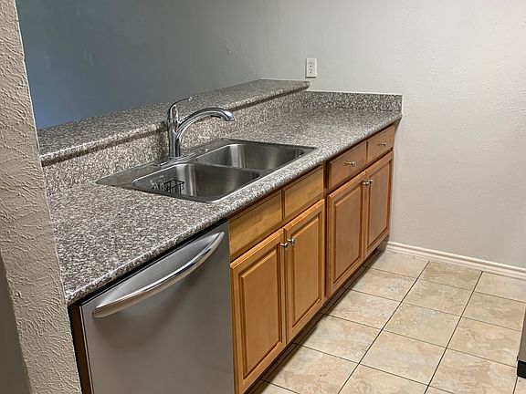 Stainless steel dishwasher included.
