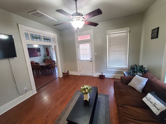 living room, front door, view of dining room