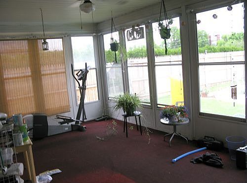 Large Florida room overlooks in-ground pool