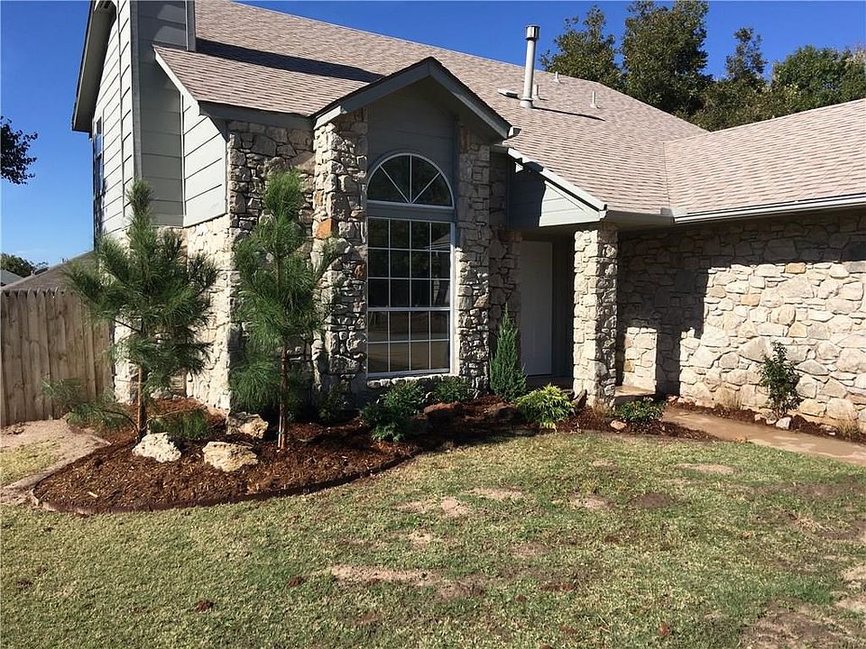 Front entry with new landscaping. Dirt patches are from leftover landscaping dirt.