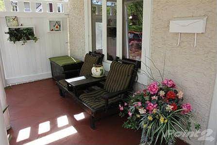 Protect your family and guests from the weather with this perfect front porch.
