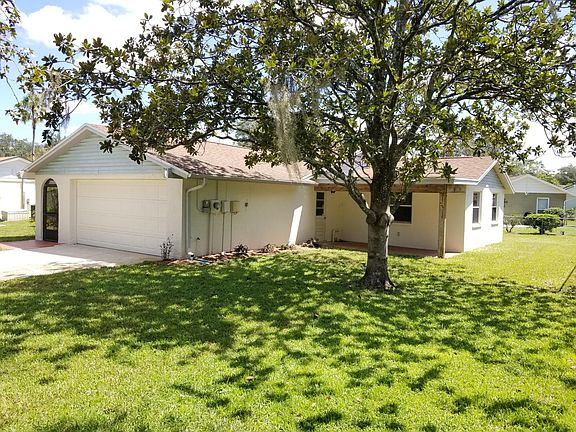Covered porch with side access to garage.