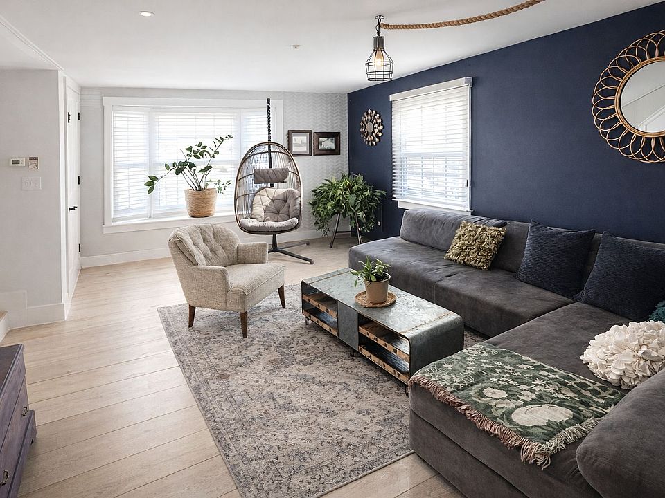 Bright, inviting living room with warm wood floors and natural light.