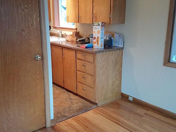 The dining area leading into the kitchen