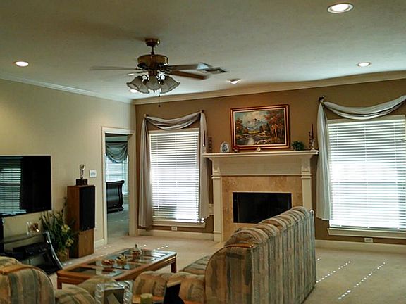 Spacious Family Room with gas log fireplace, Double pane windows, Recessed lighting