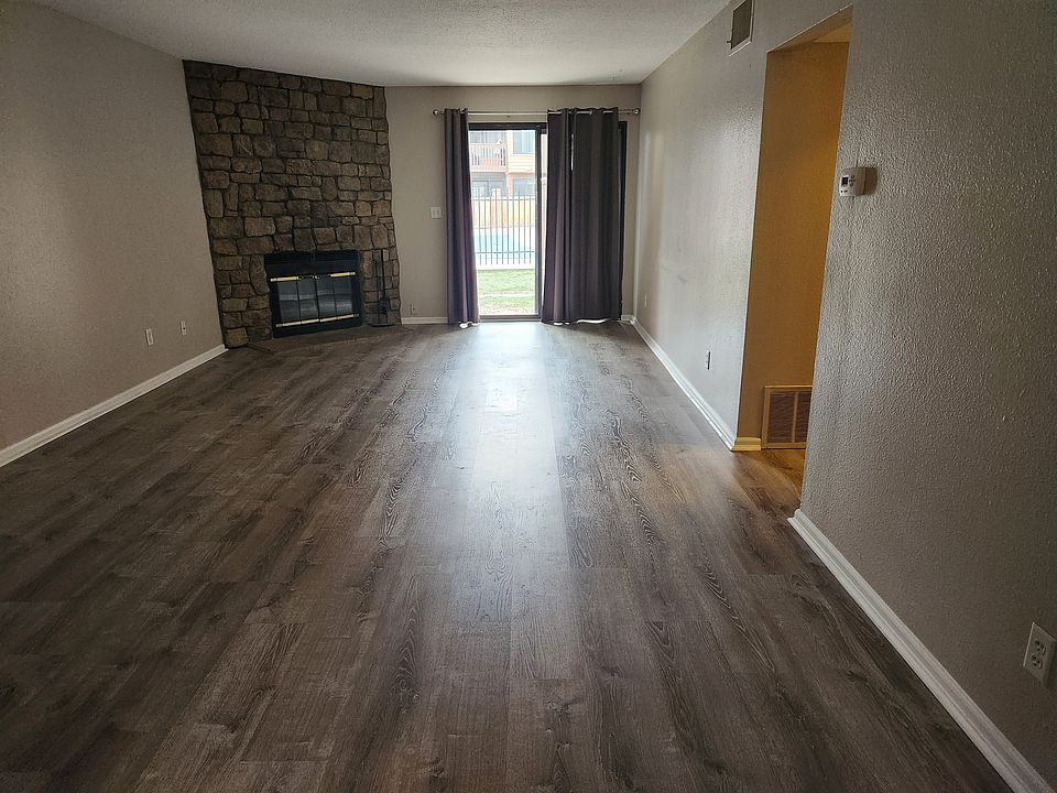 Living room from kitchen to walkout sliding glass doors.