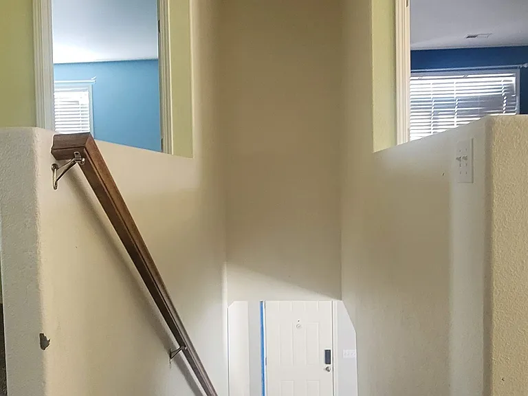Upstairs far door is the house entrance