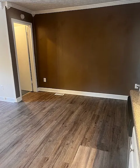 Open kitchen, showing dining nook and door leading to basement