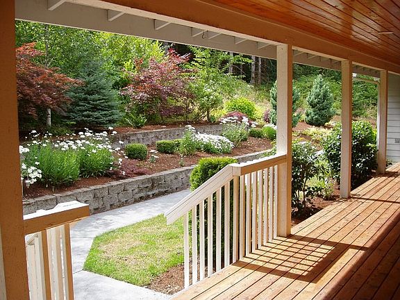 Large Wrap-Around Deck Looks Out Toward Private Acreage