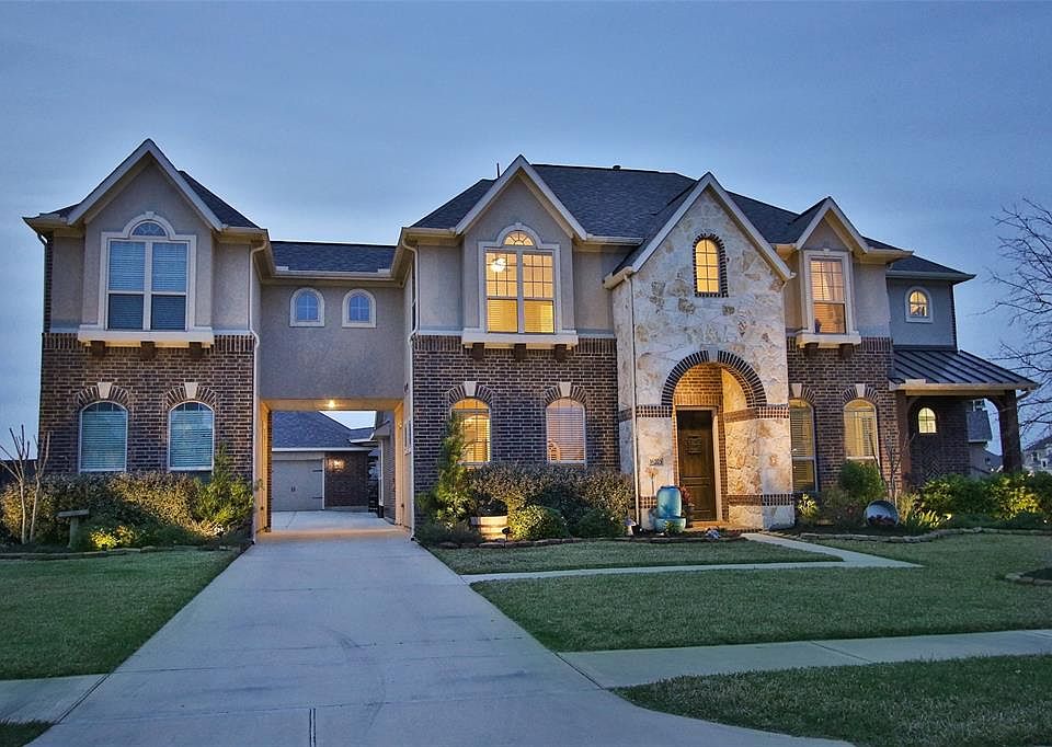 Beautiful home has a 4 car garage plus a 10' bump out! Well landscaped to make it so appealing!