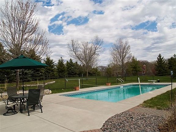 Inviting in-ground pool with electric cover