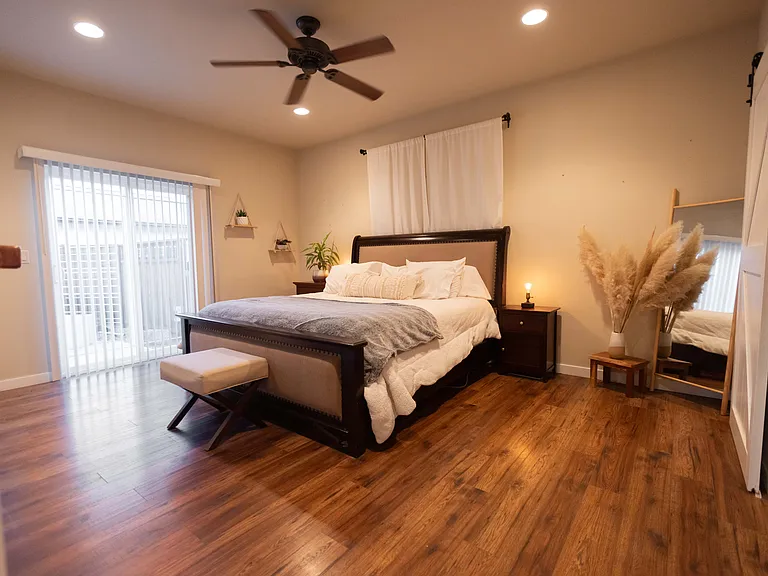 Master bedroom with another private entrance/exit sliding glass door leading to backyard
