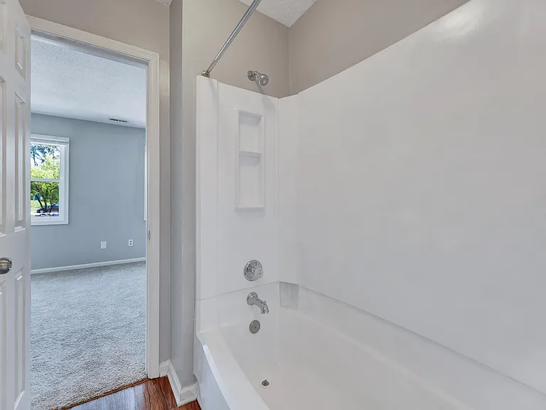 The shower features a garden tub and new hardware