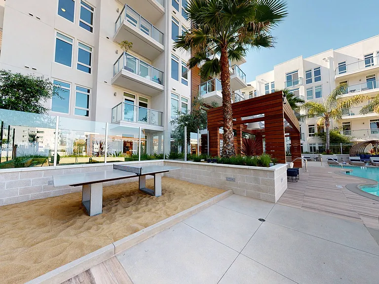 Put your toes in the sand and play some ping pong