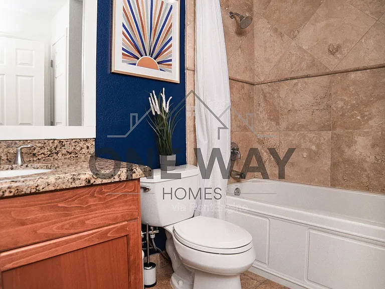 8702 E Sheridan St — Photo 9