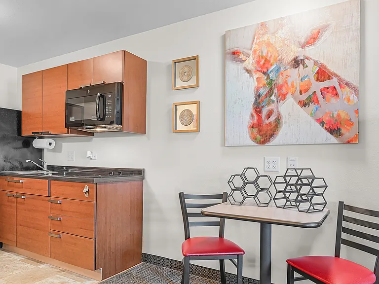 Kitchens include full sized fridge, cooktop range, and microwave.