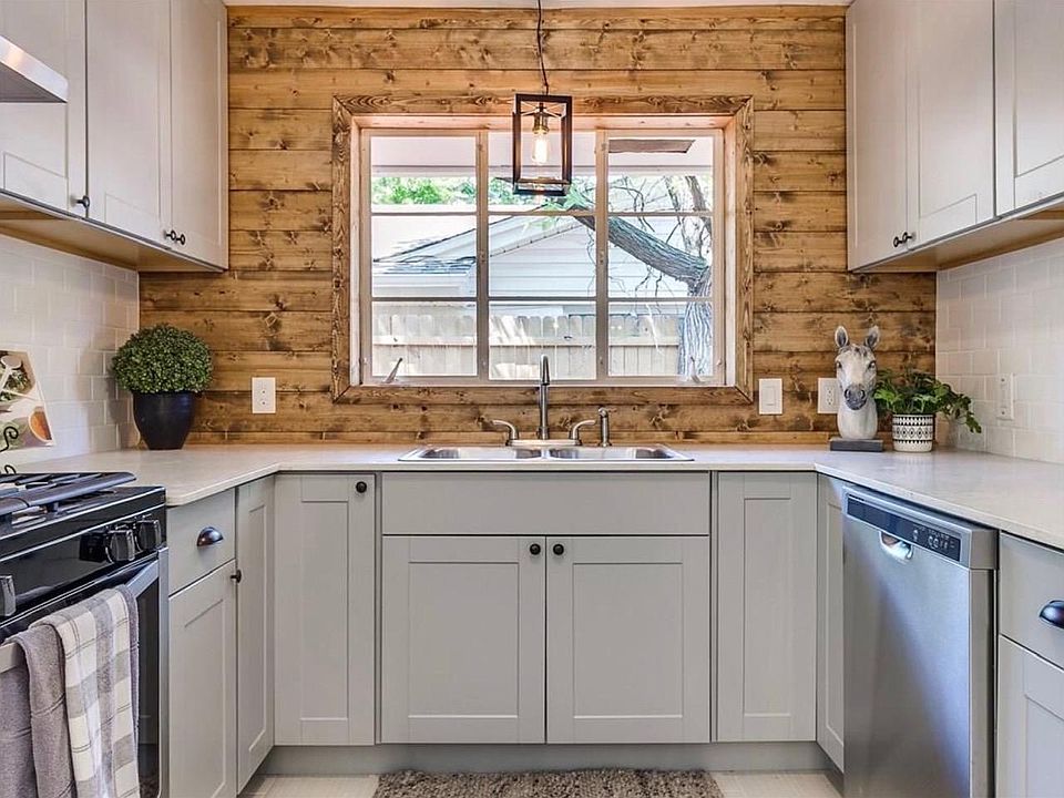 Your dream kitchen! Completely renovated with quartz countertops, all new stainless appliances, new cabinets, lighting & flooring.