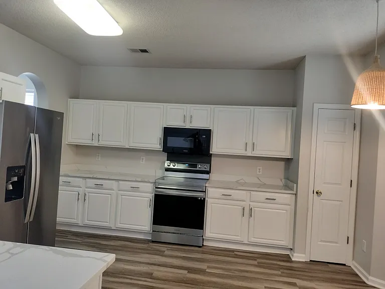 Large Kitchen with Quartz Countertops and separate Breakfast Area
