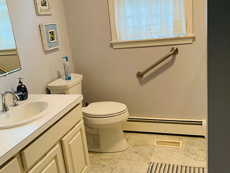 The bathroom features marble radiant heated floors and a large walk in shower with glass door