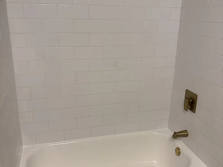 brand new shower! New tiled walls, fixtures, and resurfaced original tub