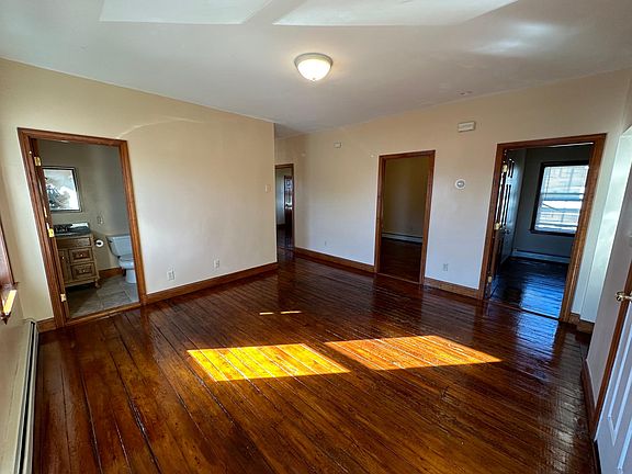 The dining room shows 2 bedrooms off it.